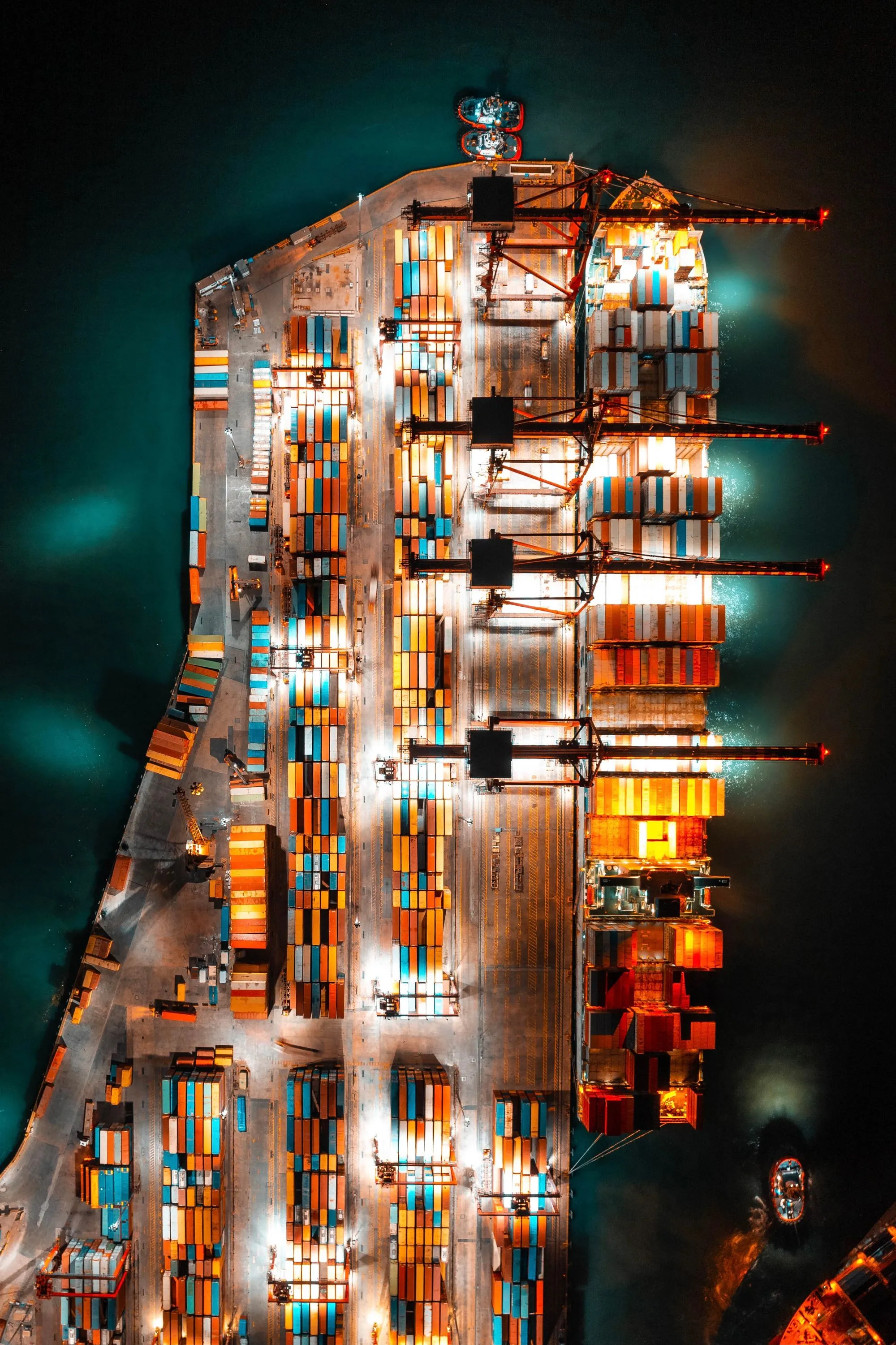 Aerial view of a container terminal, boxes stacked in blocks.